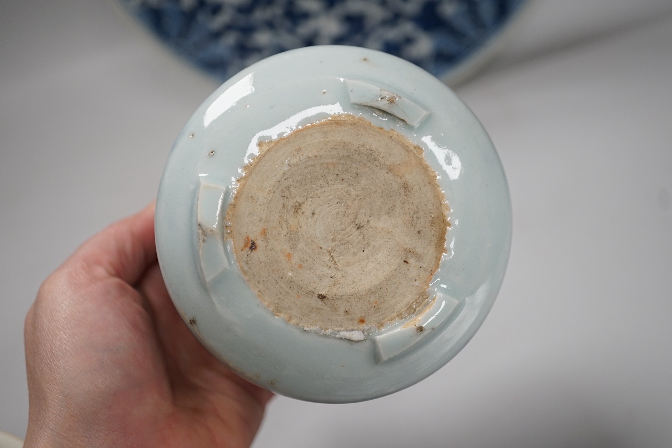 A Chinese blue and white ‘lotus’ charger, together with a bowl and dragon pot on tripod base